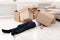 Man crushed underneath cardboard boxes