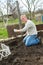 Man cultivates raspberry seedlings