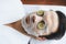 Man customer indulges in rejuvenating with cucumber facial care. Quiescent