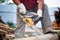 Man cut with saw. Dust and movements. Woodcutter saws tree with chainsaw on sawmill. lumberjack