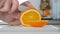 Man Cut in Slices a Sweet Orange Fruit Using a Knife Preparing Organic Dessert Full with Vitamins