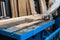 A man cuts a board on a stationary circular saw in a carpentry workshop