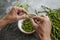 Man cuts the edible part of some wild asparagus