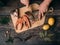 Man cuts a knife fresh raw trout into pieces for cooking