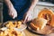 Man cuts pumpkin in the kitchen