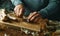 man cuts the roots of some raw calcots typical of catalonia