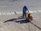 Man cutting asphalt with machine