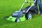 Man cutting the grass with lawn mower