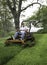 Man cutting grass on lawnmower