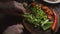 Man is cutting green pepper on a cutting board. Video