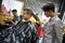 Man is cutting his hair in asian barbershop