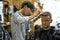 Man is cutting his hair in asian barbershop