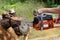 Man cutting lumber with chainsaw