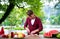 Man cutting meat for barbecue grill