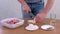 Man cutting onion on rings and put to pieces pork meat shashlik to marinate.