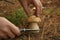 Man cutting porcini mushroom with knife in forest, closeup