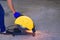 A man cutting steel with a electric steel cutter machine