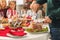 Man cutting tasty ham during Christmas dinner