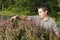 Man cutting and trimming hedges