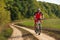 Man is cycling in autumn forest