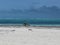 Man cycling on the beach