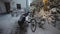 Man cyclist brushes his bicycle in the backyard in winter before taking it into the parking garage. Winter cycling and