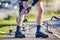 Man, cyclist and legs in knee injury, accident or pain after cycling exercise, fitness or outdoor workout on road