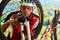 Man cyclist repairing a bike against blue sky