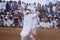 A man dancing in a bull race event