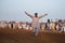 A man dancing in a bull race event