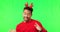 Man, dancing and Christmas hat by green screen, comic face or funny in holiday fashion, smile or mockup space. Guy