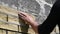 Man decorates the facade of a wall with decorative bricks, close up view. Process of cladding walls of constructions