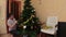 Man deinstall Christmas tree in his home