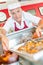 Man in deli holding tray food