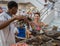 Man demonstrates how to roll a perfect Cuban cigar