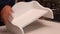 A man demonstrates a self-assembled table shelf. Assembling furniture at home. Close-up