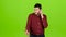 Man dials a familiar number and starts talking. Green screen