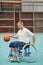 Man with disability playing basketball game