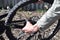 A man dismantles the rear wheel of a bicycle