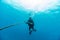 man diving in deep blue indian ocean