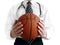 Man doctor with basketball ball in hands