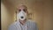 Man doctor in ppe mask walking in long corridor in hospital