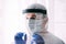 Man doctor or scientist wearing protective suit and face mask