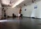 Man does Handstand inside yoga studio
