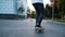 Man does on a skateboard a trick kickflip and fails close up, slow motion