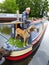 A man and dog on narrowboat