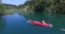 Man doing backflip from a canoe on Mreznica river, Croatia