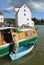 Man doing boat repairs at Woodbridge Quay