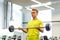 Man doing exercise with barbell in gym