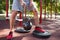 A man is doing exercises on his feet. Sporty and healthy young man with perfect body exercising outdoors.